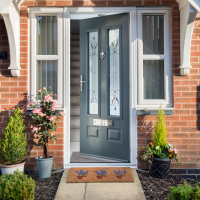 Edinburgh in Granite Grey with Park Lane glazing and floral front garden decorations