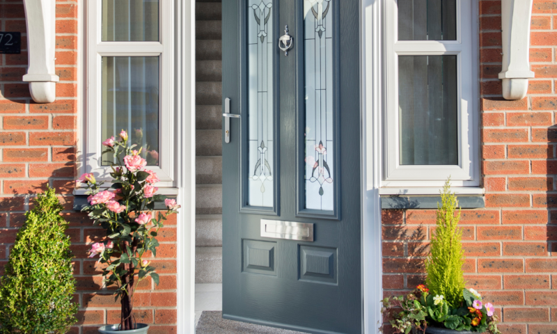 Edinburgh in Granite Grey with Park Lane glazing and floral front garden decorations